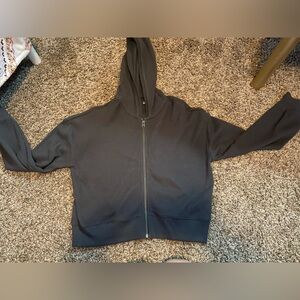 Only worn once, cropped sip up.